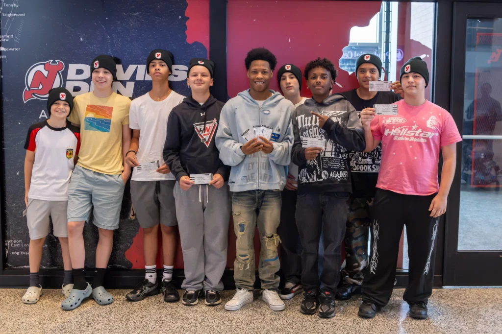 Hockey in New Jersey players show off their tickets outside the Devils Den at the Matchroom Boxing press conference at Prudential Center