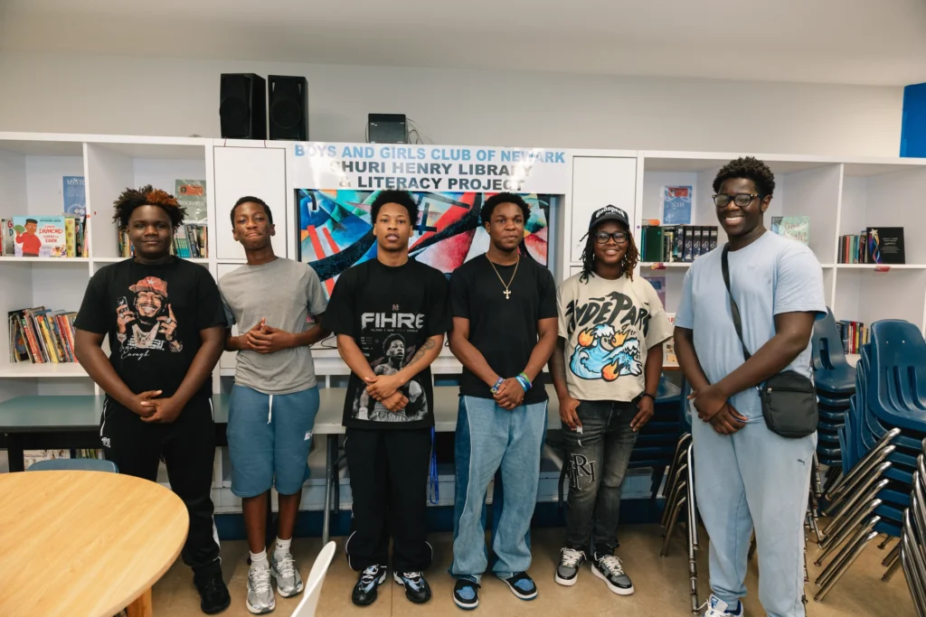 Group photo at the Shuri Henry Library & Literacy Project during Zaquin Moses's visit to the Boys & Girls Club of Newark