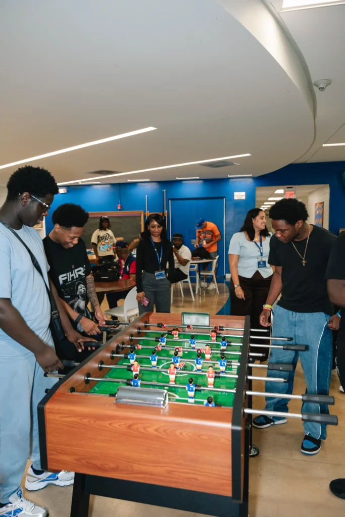 A game of foosball during Zaquin Moses's visit to the Boys & Girls Club of Newark