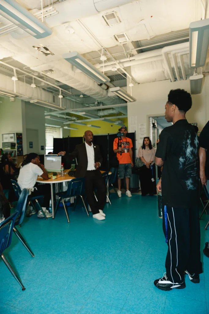 A club leader gives a tour during Zaquin Moses's visit to the Boys & Girls Club of Newark